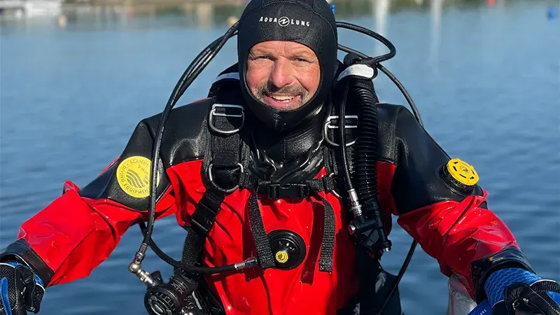 Tony Sampson in dive gear preparing for an underwater retrieval