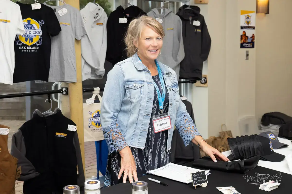 The merch lady at the Oak Island Con merchandise booth
